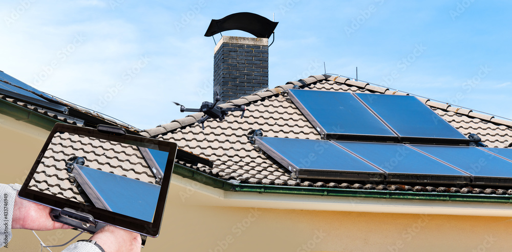 Inspection drone hovering above a rooftop solar array