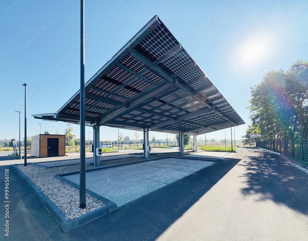 Commercial solar carport rows over a parking lot